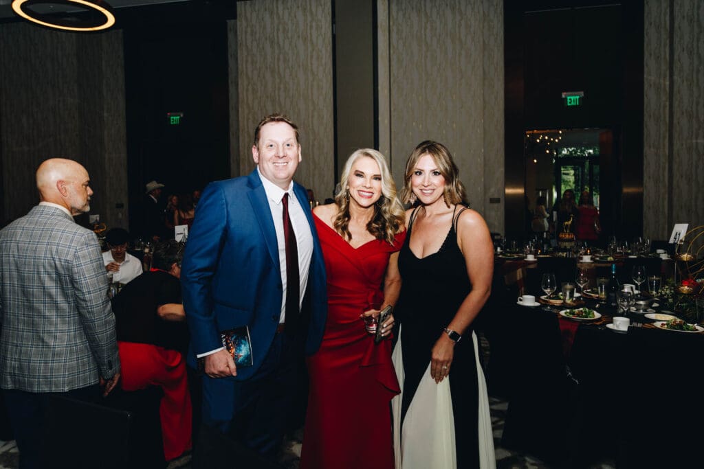 Love Fosters Hope Board Member Michael Goodwin (left) and Executive Director Kristi Horton (middle), were among the guest speakers of the event delivering hope and encouragement. (Photo by Cindy Janette)