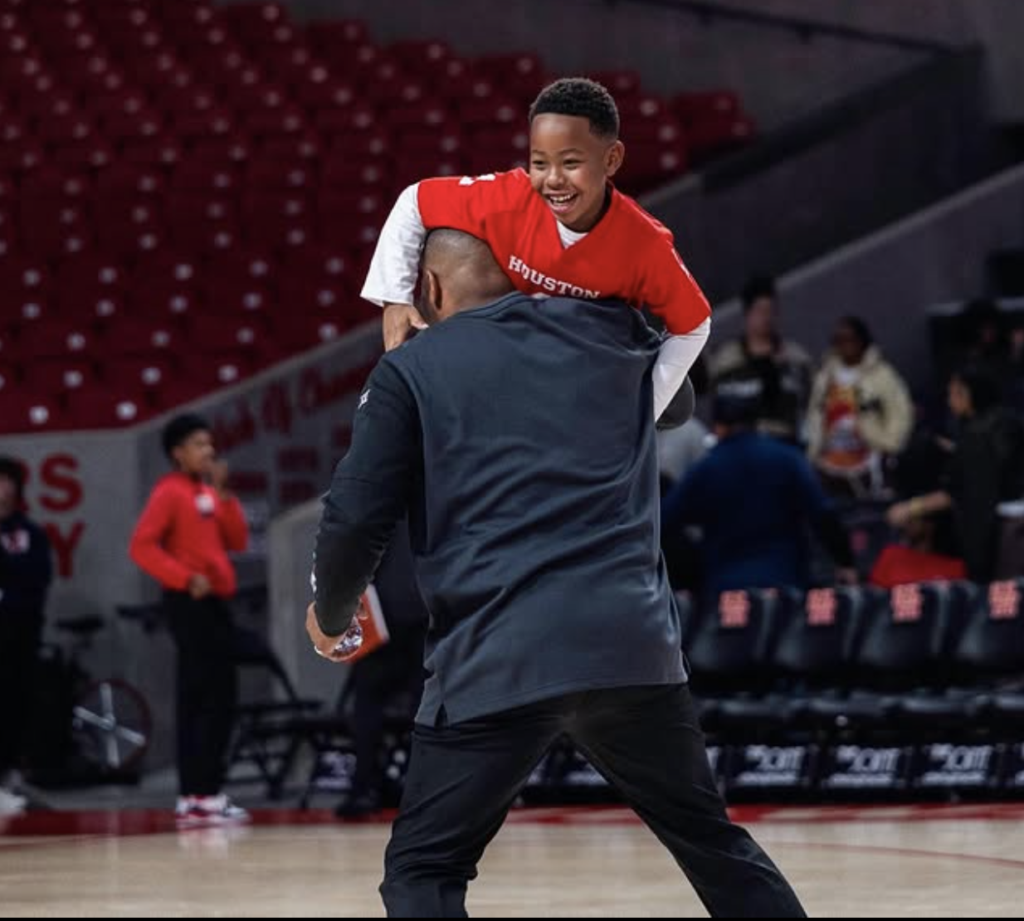 Former University of Houston women's basketball coach Ronald Hughey is beyond proud of his son Hunter.(@CoachHughey1)