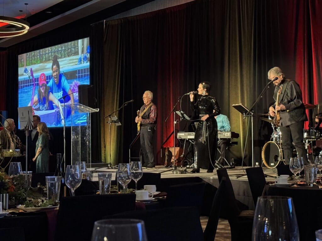 A powerful and moving tribute video highlighted the impact of Love Fosters Hope camps and programs for foster youth while a live band played "This is Me." (Photo by Jillian Richstone)