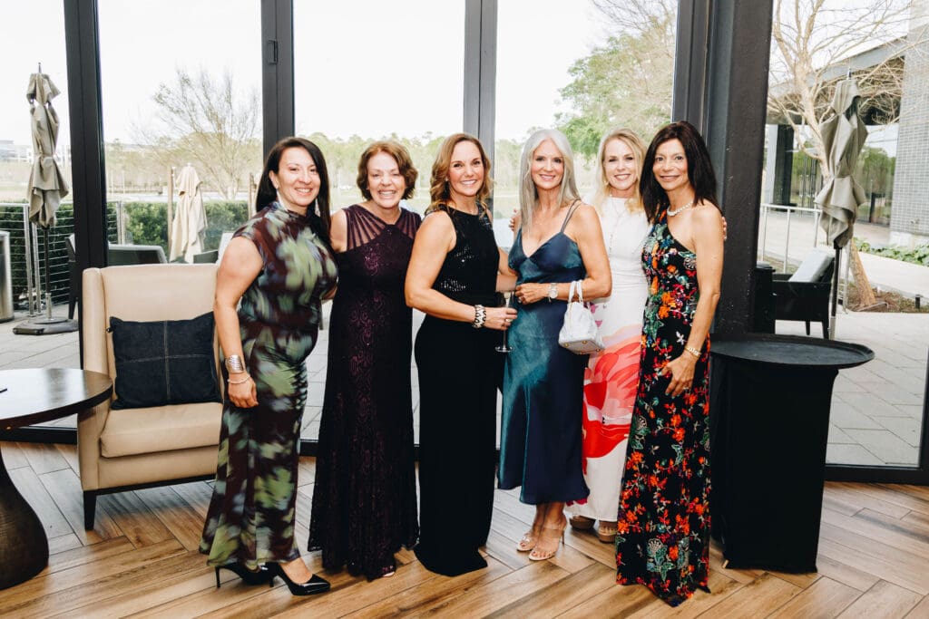 "Glitzy cocktail" was the dress code for the evening, and guests dazzled in their best dresses. (Photo by Cindy Janette)