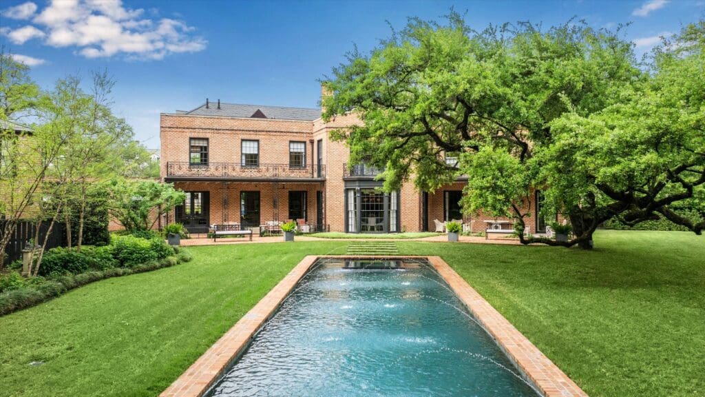 The in-ground swimming pool at 3 Remington Lane features dancing fountains. (Photo by TK Images)