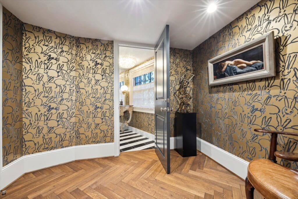 One of three half baths, this one dressed in Hunt Slonmen's bunny wallpaper. (Photo by TK Images)