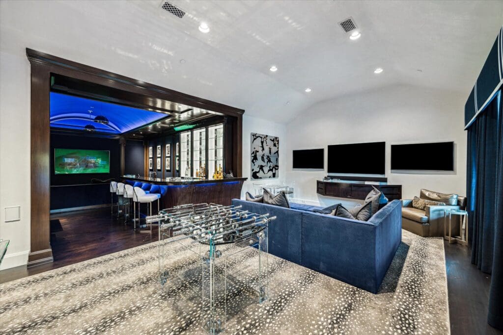 Multiple TVs add entertainment value to the second floor game room (Photo by TK Images)