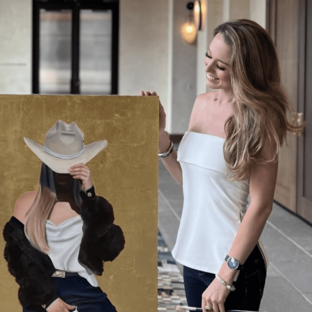 Jackson poses next to a gold-leaf painting. (Photo by  Bowie House)