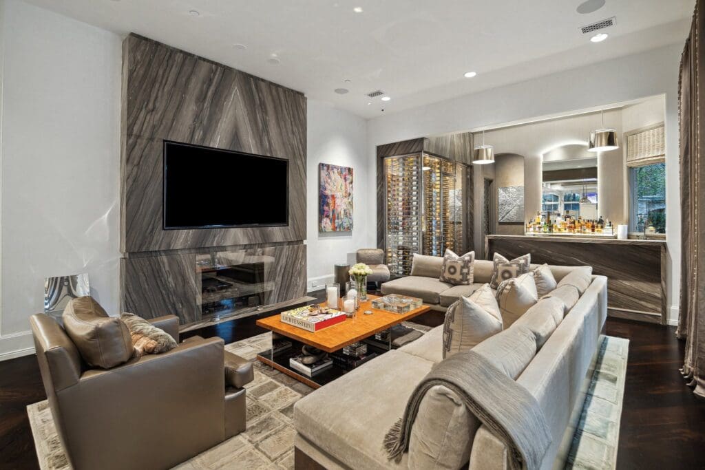 The family room that opens to the wine room and the kitchen at 220 Merrie Way Lane (Photo by TK Images)