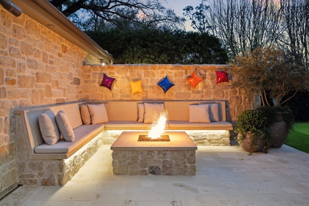 A side lawn sitting area with fire pit at 220 Merrie Way Lane (Photo by TK Images)