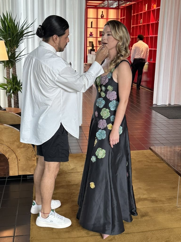 Juan Peralta gives Best Dressed honoree Alexandra Killion a touch up (Photo by Shelby Hodge)