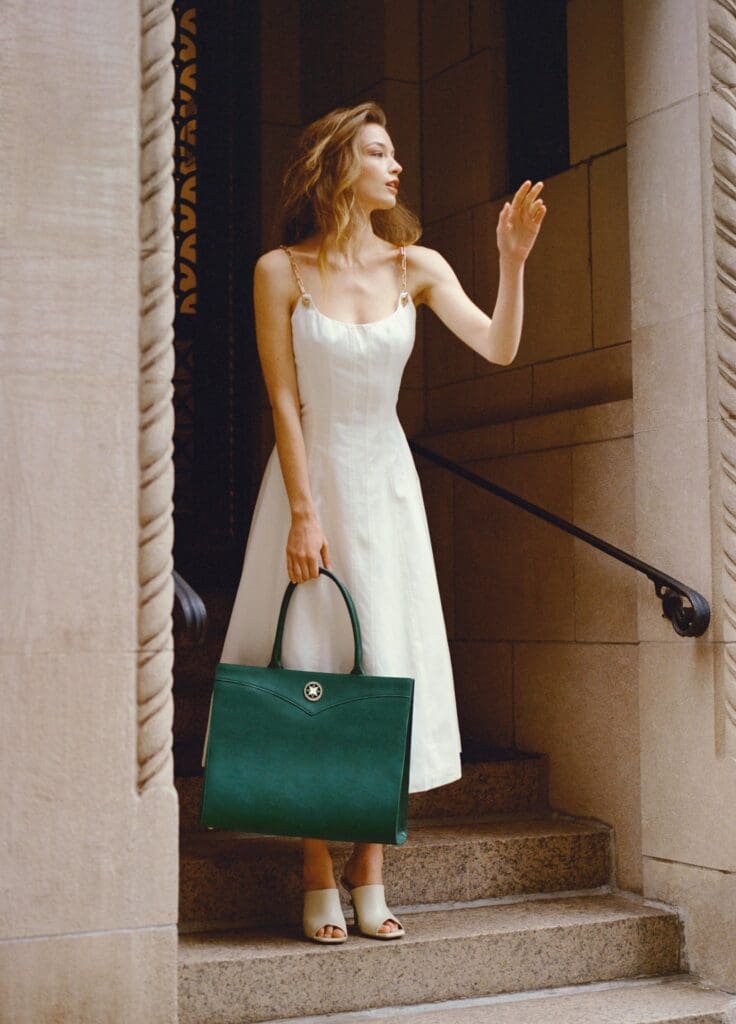 The Annabelle Tote  from 11 Juillet with the signature bejeweled medallion.