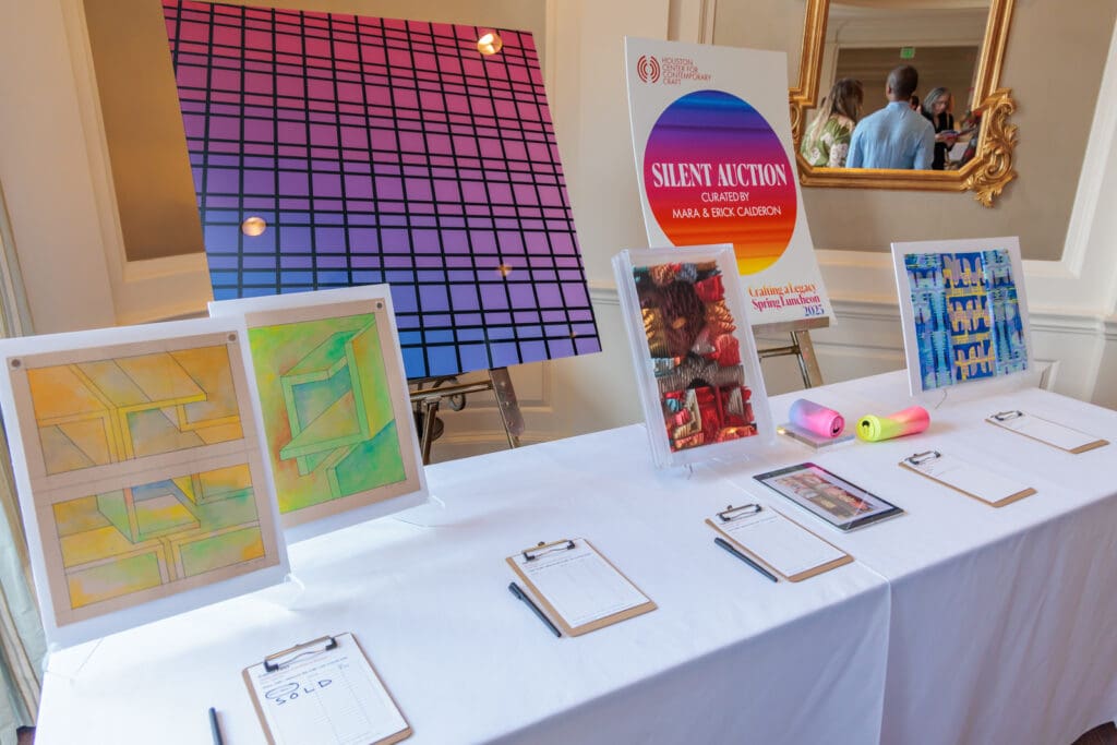 A portion of the silent auction featured generative and architecturally inspired art curated by honorees Mara and Erick Calderon. (Photo by Katy Anderson) 