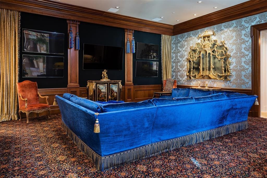 5100 Park Lane features a media room with five TVs, a 120-inch drop-down screen, and a full wet bar. (Courtesy)