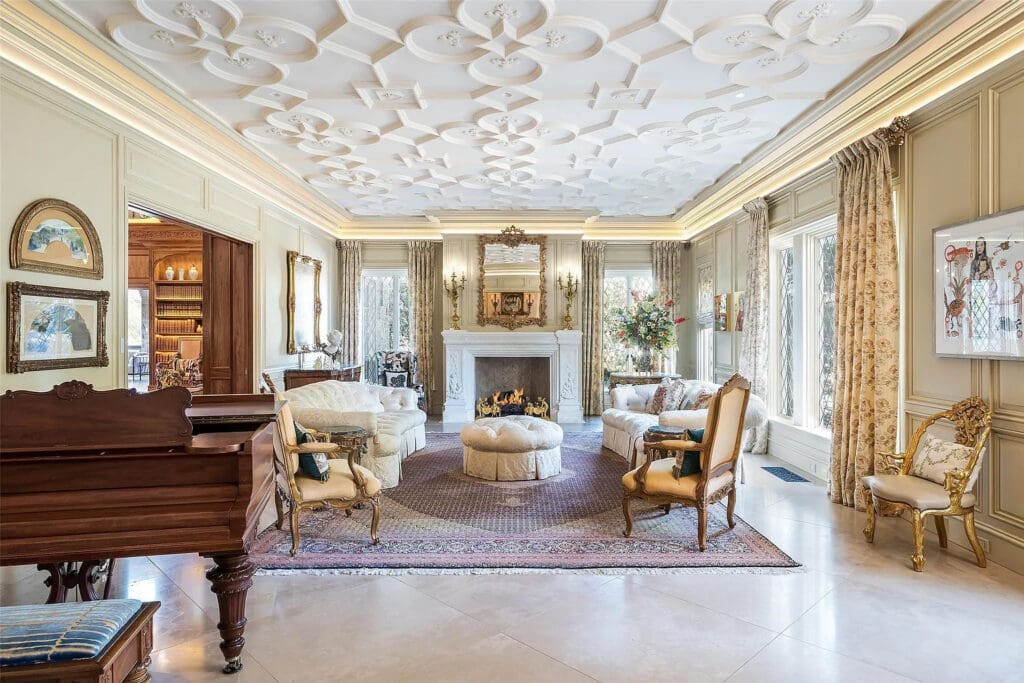 Designed by the late architect Cole Smith, the elegant English-inspired home at 3711 Lexington Ave features a two-story great room that opens to a screen porch with a fireplace and views of the park, a formal dining room with a view of the rare, one-acre lot the home is situated on, and so much more. (Courtesy)