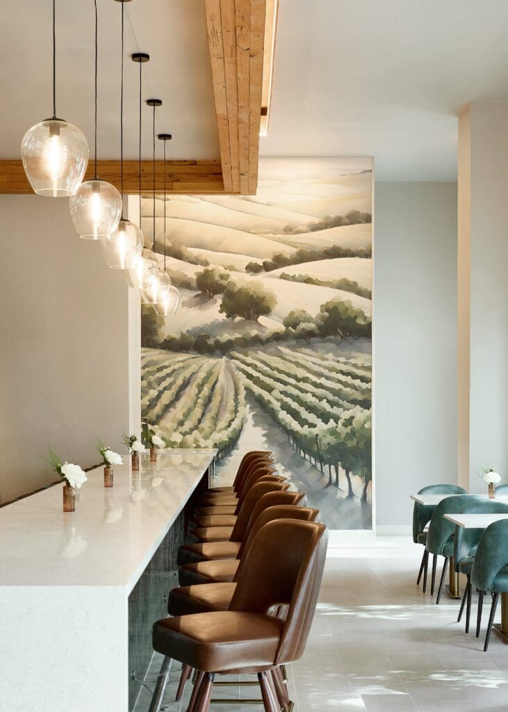 The Board Room is built with a soaring ceiling, expansive bar, and a floor-to-ceiling custom mural. (Photo by Natalie Goff)
