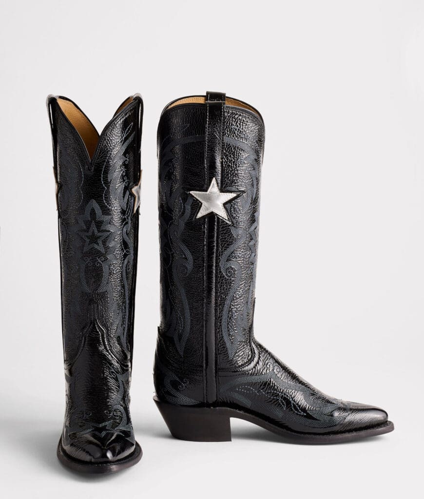 One look is all it takes to know that the Dallas Cowboys Cheerleaders inspired the "Gina" boots. Rendered in black patent leather, the new iteration features a perfectly balanced vamp and quarter stitch pattern and is, of course, completed with the iconic Dallas Cowboys star logo. (Photo by Lucchese)