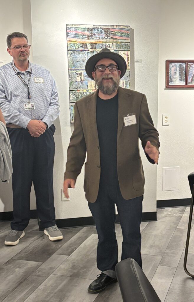 Dandridge Reed, art teacher at Grand Oaks High School, speaks about his work at the opening of "Lessons in Expression" at The Woodlands Arts Council's gallery space. (Photo by Laura Landsbaum)