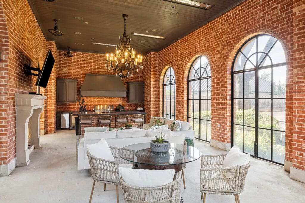 The cabana also provides remote screened living and dining areas with ceiling heaters, ensuring year-round entertaining and true indoor-outdoor living. (Photo by Allie Beth Allman & Associates)