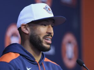 Carlos Correa is all thumbs up on his return to the Astros, living in Houston again and being back with Jose Altuve. (Photo by F. Carter Smith)