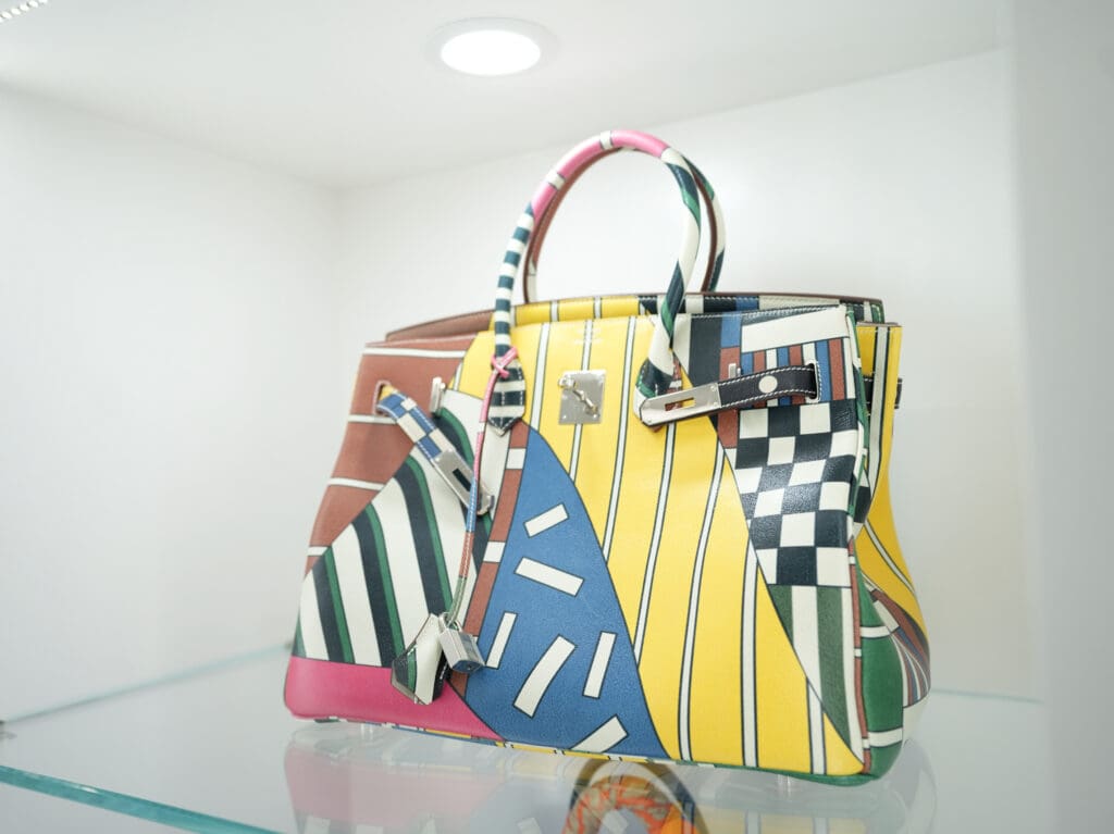 This is a Hermès Birkin bag, the limited edition "One Two Three and Away We Go" Birkin, designed by Nigel Peake.
