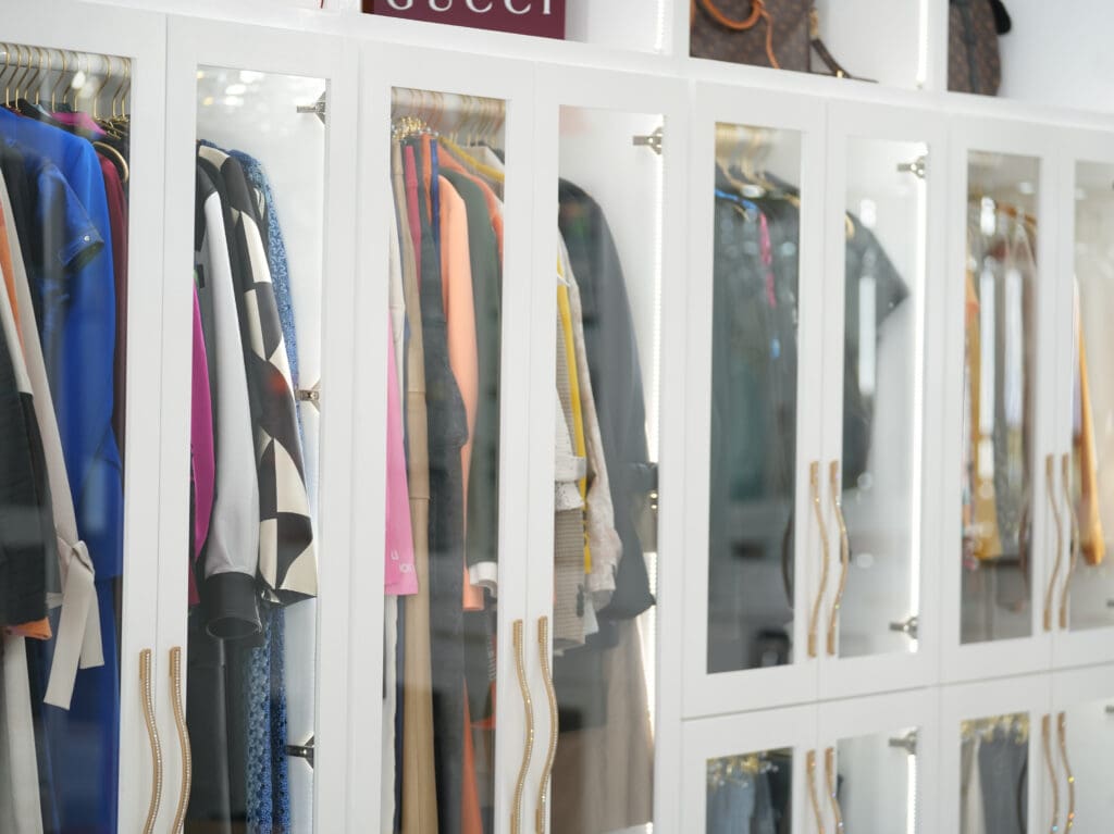 Long closet cabinets are Roemer's spot for suits, like her favorites from Jose Sanchez.