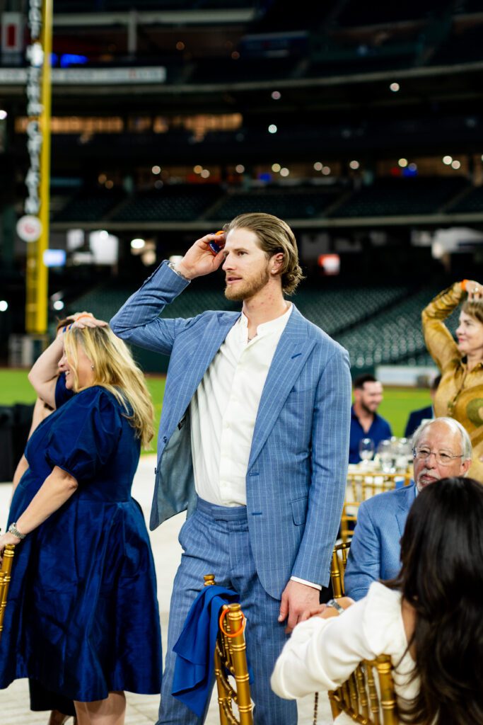 Pitcher Josh Hader plays Heads or Tails at the Houston Astros Foundation Wine Dinner on the field at Daikin Park. 