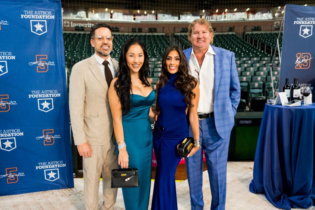 Jose & Nancy Almodovar, Zinat Ahmed & Pete Bell at the Houston Astros Foundation Wine Dinner on the field at Daikin Park. 