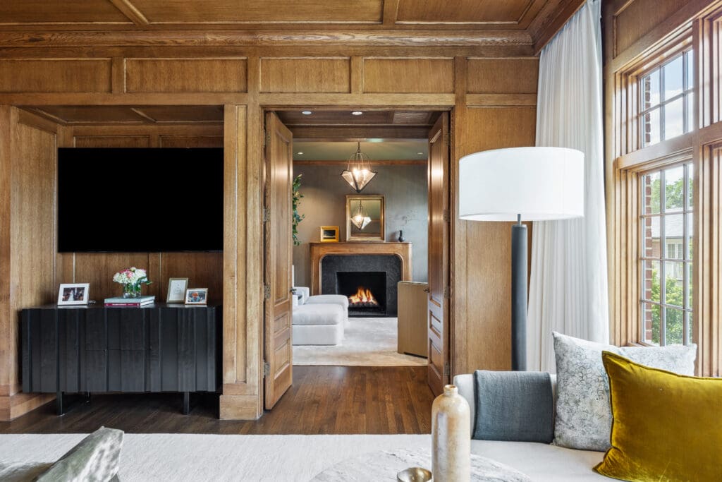 The primary bedrooms features his and hers bathrooms, walk-in closets with custom storage, and a decadent sitting rooms that boasts a gas fireplace, providing a tranquil retreat as it overlooks the backyard. (Photo by Full Package Media / Compass)