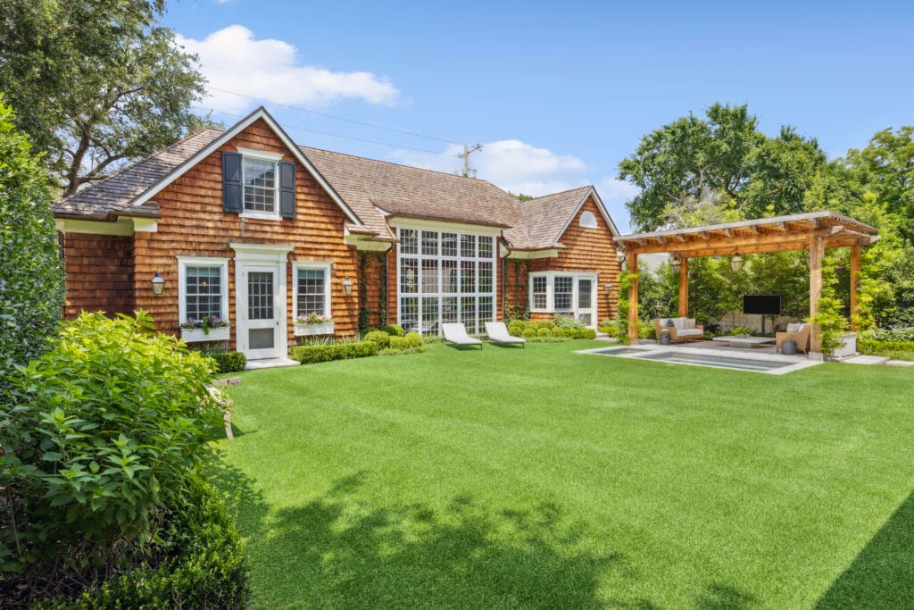 3636 Stratford Avenue has it all— perennially green turf, a movie screen projector with surround sound, a shaded pergola, a walk-in cold plunge pool, and a putting green. (Photo by Full Package Media / Compass)