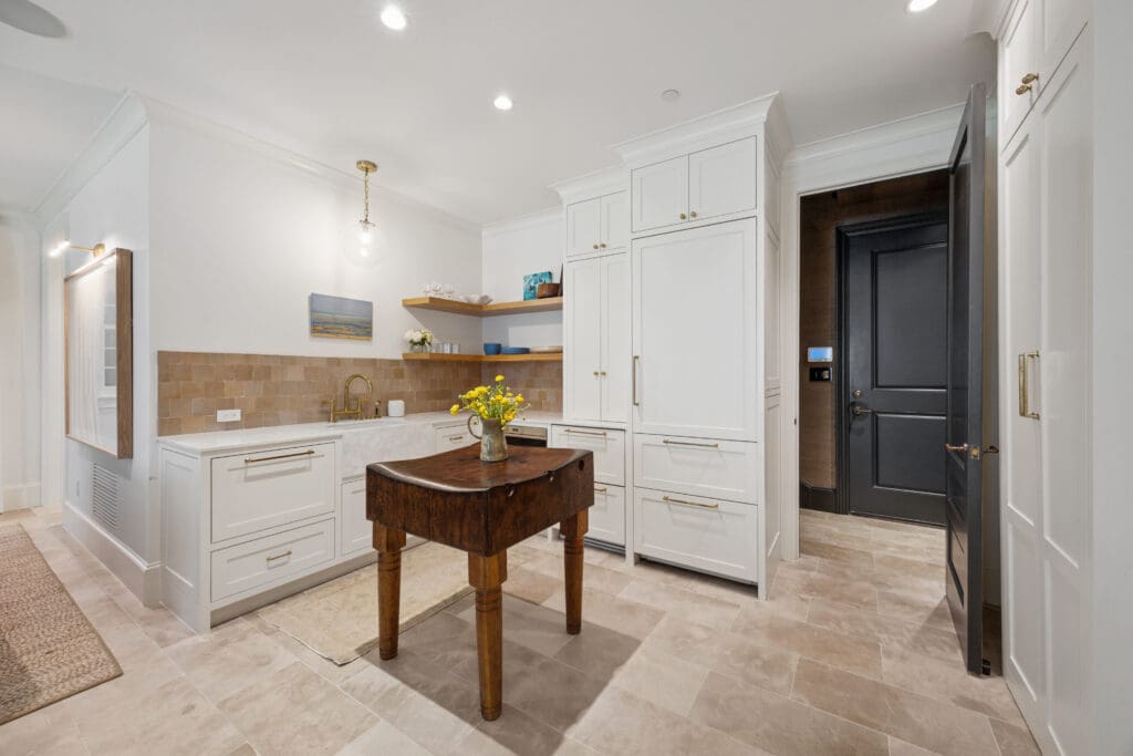 Downstairs, it offers a living space (with a hidden Murphy bed), kitchen, and full bathroom. (Photo by Full Package Media / Compass)