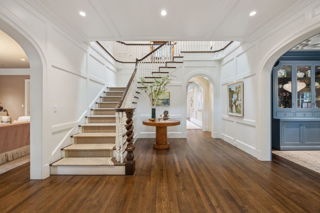 A formal living room and dining room flank the entry. (Photo by Full Package Media / Compass)