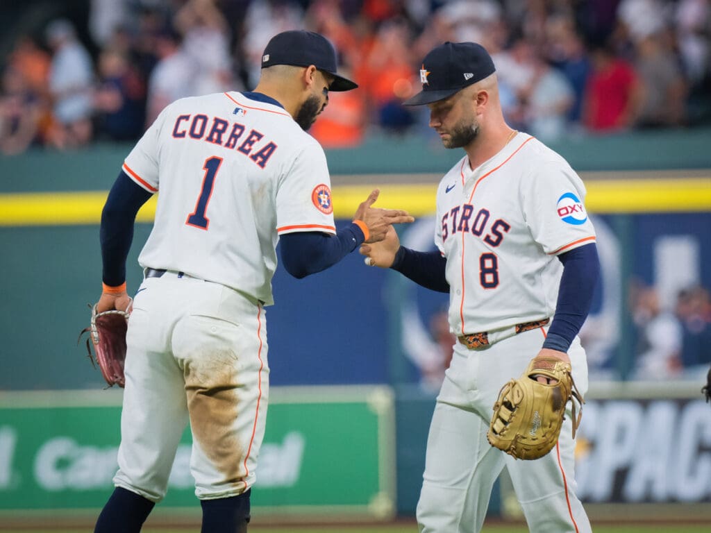 Carlos Correa knows that Christian Walker's glove work at first base is invaluable to the Astros' defense. (Photo by F. Carter Smith)