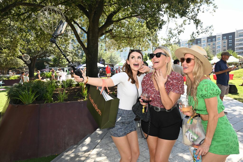 Chefs for Farmers attendees take time out for shopping at South by North in Autry Park and taking selfies. (Photo by Jack Opatrny)