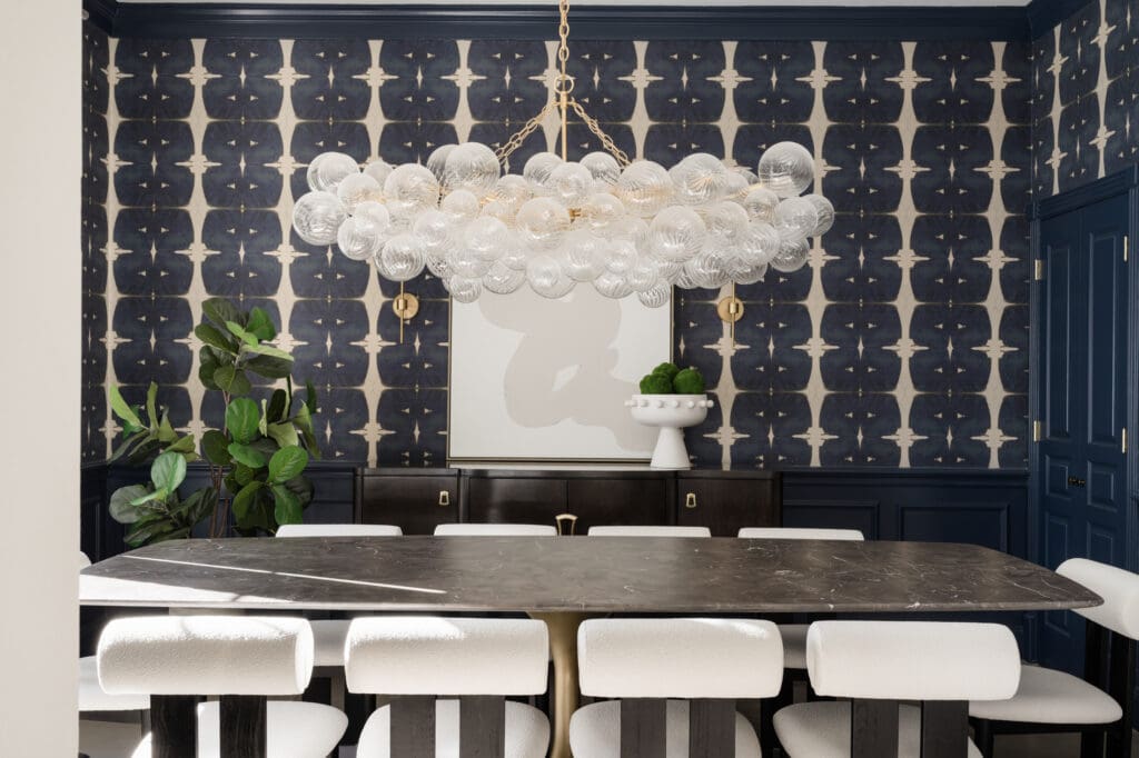 A stunning chandelier is the focal point for this Grogan's Point home's dining room.