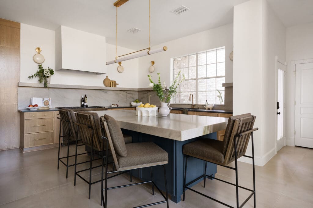 The renovated kitchen is anchored by a larger island that seats four.