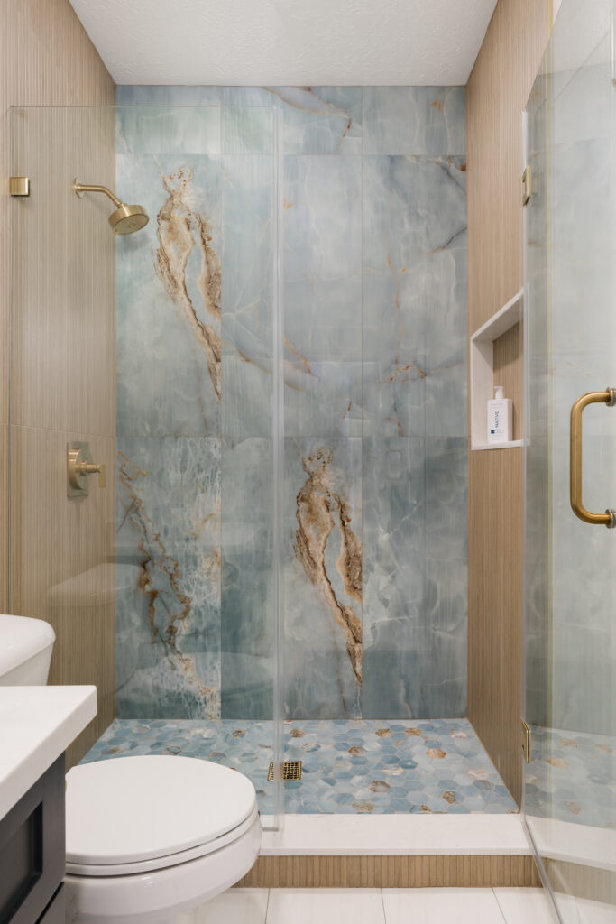 Stone in the boy's bathroom has a natural, relaxing color palette. (Photo by Madeline Harper Photography)