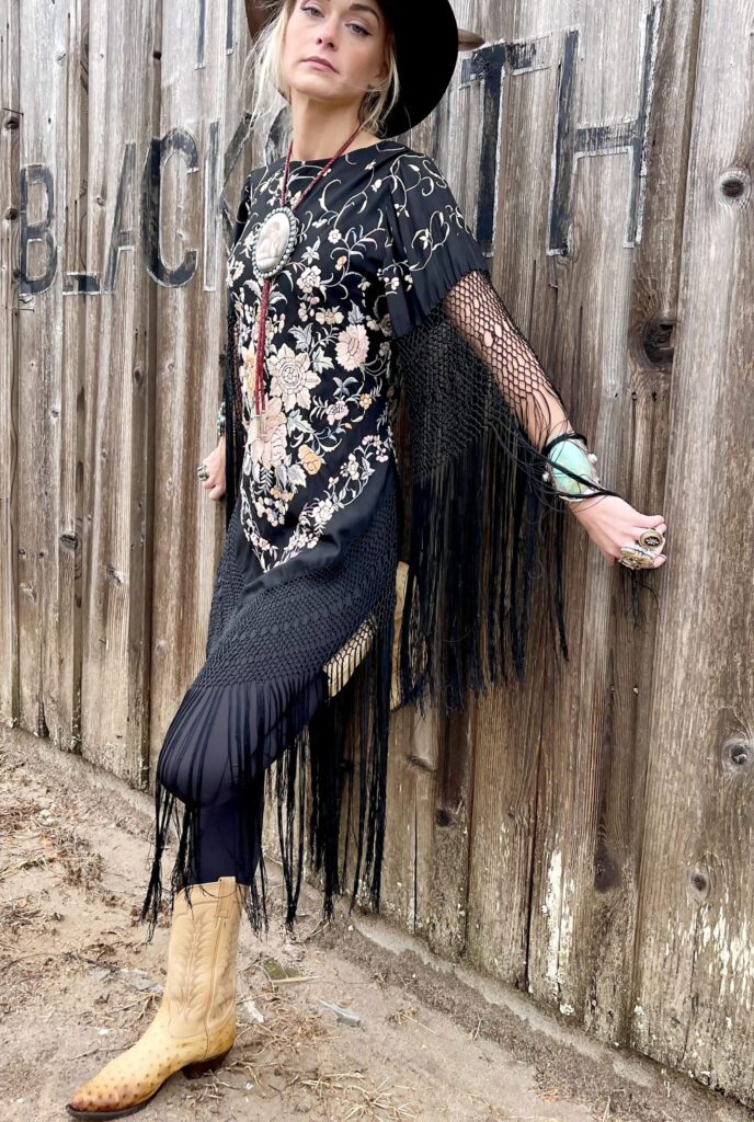 Much like her jewelry, Garber’s clothing and accessories are created with fine materials, including hand-embroidered 19th and early-20th-century silks.