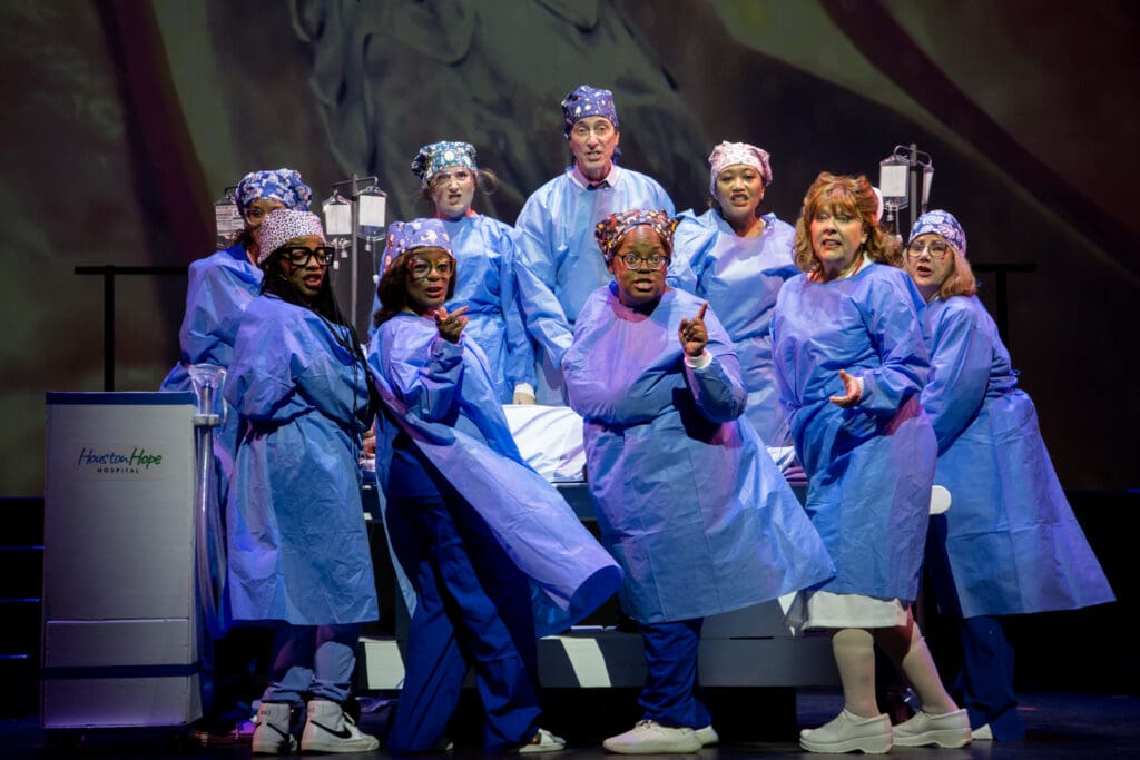 Veronica Jones as Dr. Pepper, Bri Holcombe as Dr. Meredith Grey, Marshall Campbell as Dr. Derek McDreamy, Yoka Larasati as Dr. Yang, Janiece Horn as Dr. House, Sharron Wall as Nurse Ratched, Elizabeth “Peaches” Lockett as Dailey, Uchenna Paul as Dr. Scholls and Dani Crane as Dr. Edwards in Night Court's "Law’s Anatomy: The Juris Doctor Will See You Now" (Photo by Ricornel Productions)