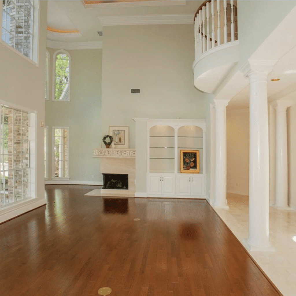 Before the renovation by Tiny Haven Design, the Grogan's Point home featured columns and multiple flooring surfaces.