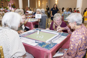 Tarrant Area Food Bank kitchen volunteers also love playing Mahjong (Photo by Sharon Ellman, Ellman Photography)