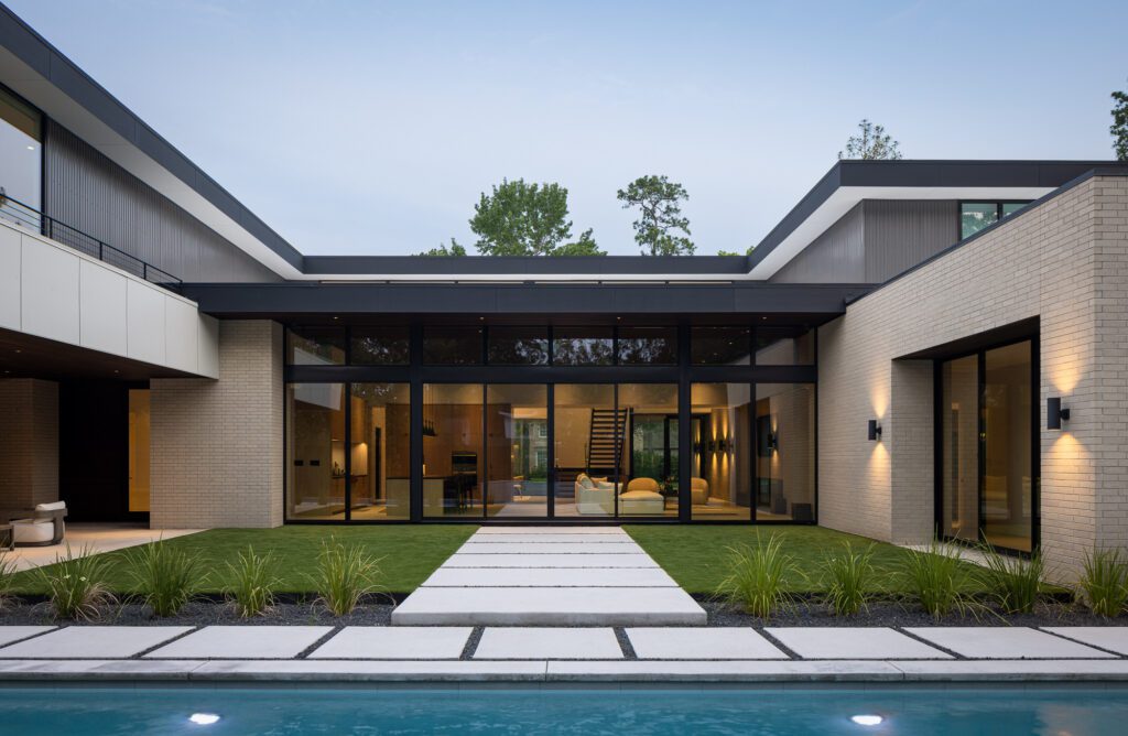 It’s defined by low horizontal rooflines, wide overhangs, and a restrained material palette that emphasizes clean lines and functional clarity.  