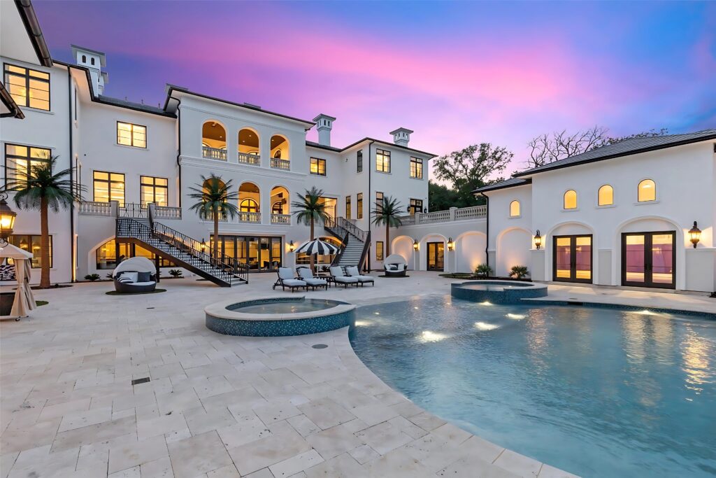 The heated saltwater pool and spa sit at the heart of 1469 Sunshine Lane. (Full Package Media)