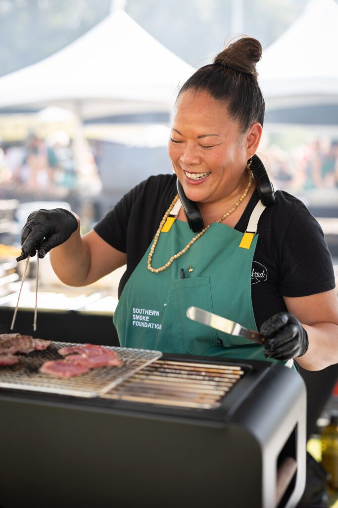 Chef Lee Anne Wong is pictured cooking at this year's Southern Smoke Festival. Photo by Huge Galdones Photography.