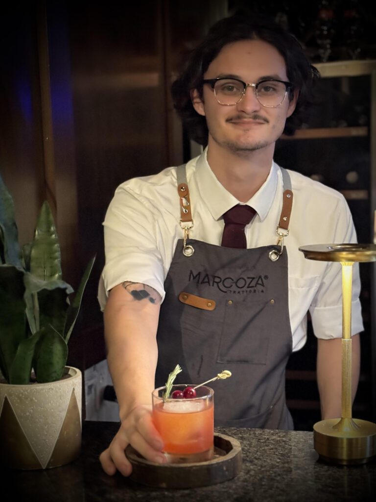 Marcoza Trattoria's David Aguilar and his "By the Fireside" cocktail. (Photo courtesy of Sherri Segari)