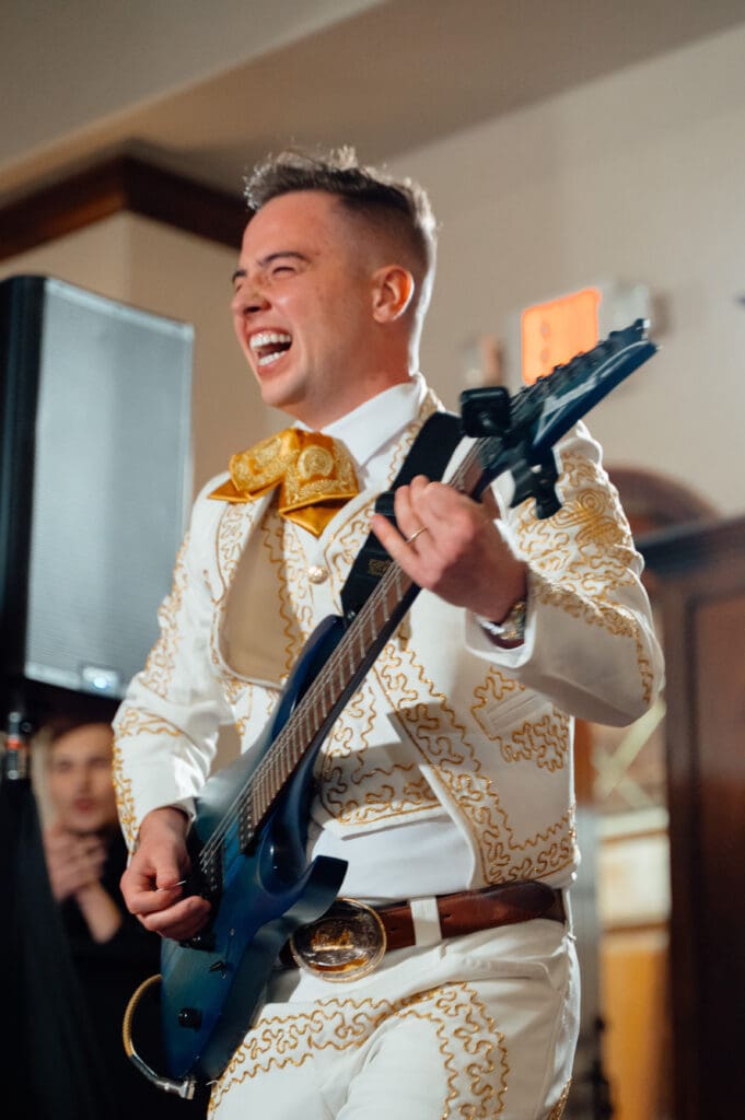 Ethan played Jimi Hendrix's "Wild Thing" at the reception, bringing in a touch of American Rock and Roll. (Photo by JMG Photography Houston)