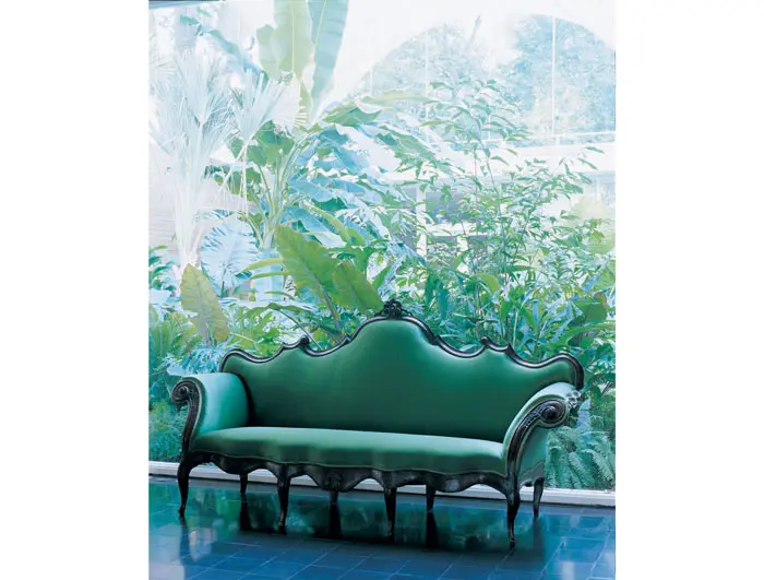 In the foyer, a jade-green, raw-silk covered Venetian rococo settee made of walnut, circa 1755-1765