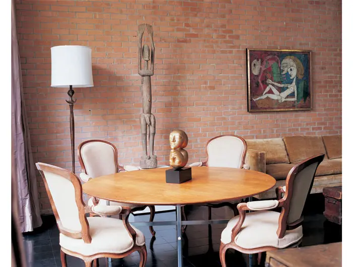 In John de Menil's study, Victor Brauner's gilded-bronze sculpture, "Sign", rests on a teak and chrome-plated table, circa the 1960s, made by L.D. Dreyer for the de Menil's office at the University of St. Thomas