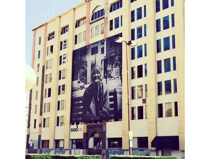 The vintage facade of 500 South Ervay was home to Sharum's portrait "Ronnie," 2014. (Through May 31, the building bears "Homeless Woman," 2014.)  