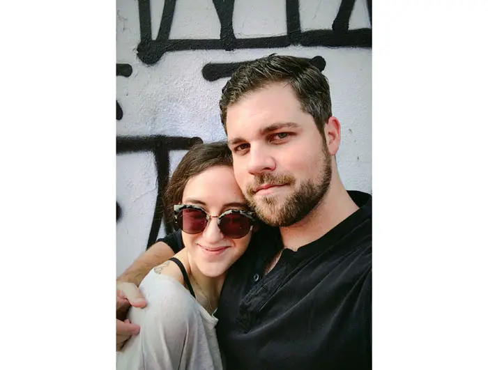 Cecilia & Garrett in front of the Retna graffiti mural