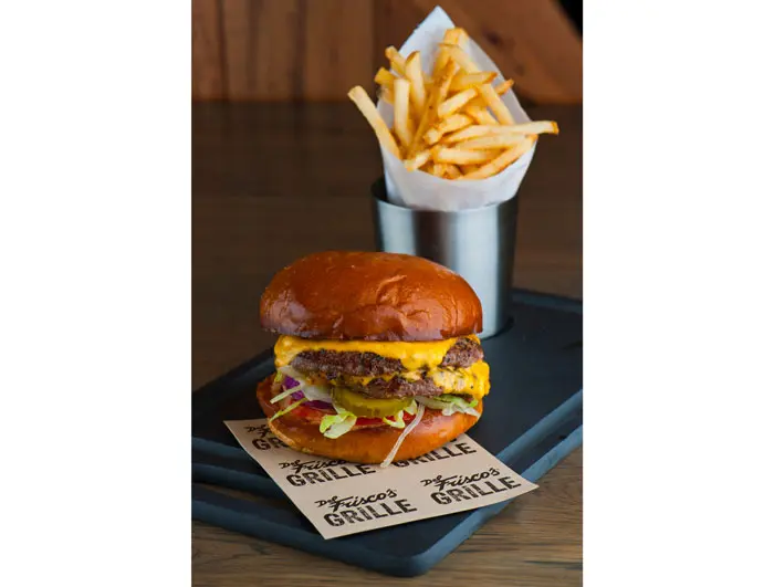 Grille Prime Cheeseburger at Del Frisco's Grille. Served with two patties made with a blend of chuck, brisket and short ribs, topped with cheese, lettuce, tomato, pickles and sloppy sauce between a brioche bun. 