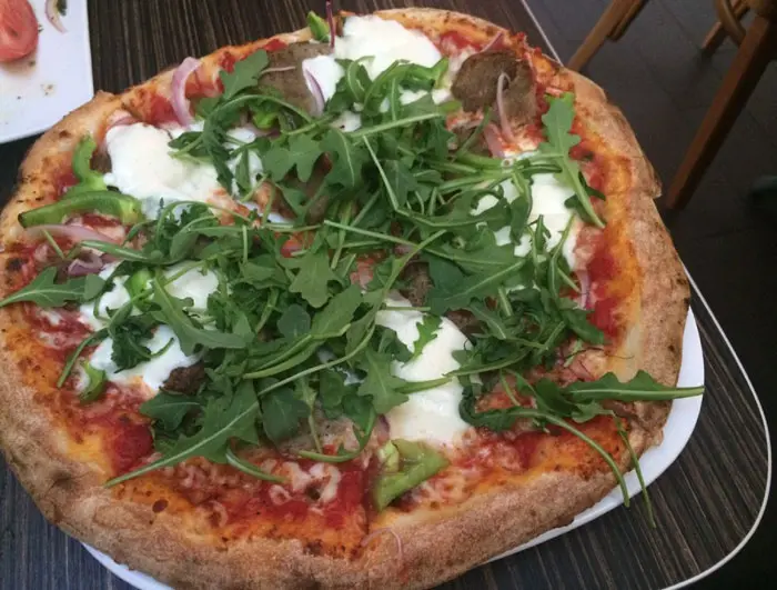 Make your own pizza at Bollo Woodfired Pizza. Meatball, green pepper, onion and fresh arugula. 