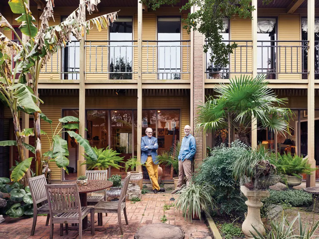 David Lackey and Russell Prince in the courtyard of their Montrose-area townhouses.