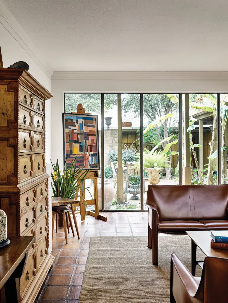 In the sitting room that adjoins their studios are a tall 19th-century Italian chest, a trio of stacking stools by George Nakashima and a pair of Cab sofas by Mario Bellini for Cassina. On the easel, Russell Prince’s collage Ignis Fatuus.